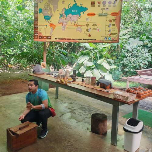 Cacao tour guide at the tasting tables with the cacao map